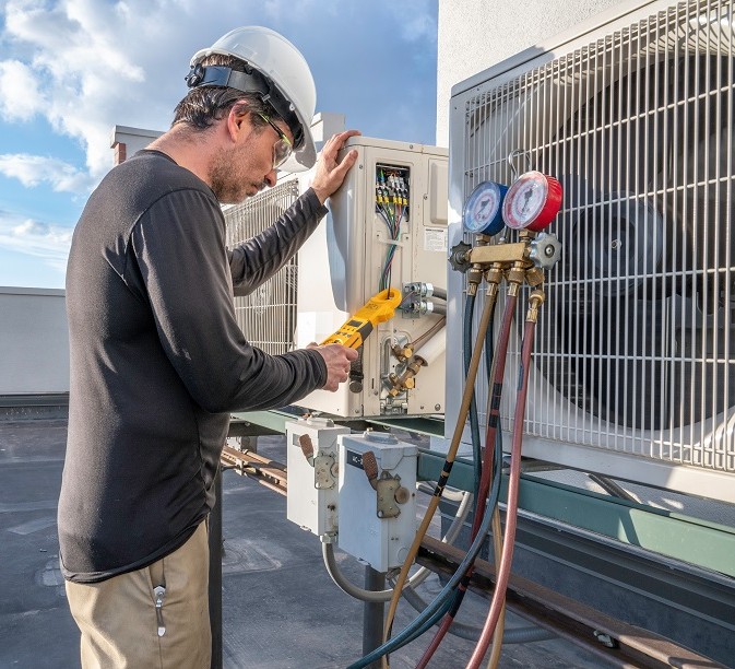 hvac technician working on mini split